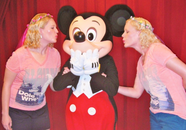 Mickey kissing two girls